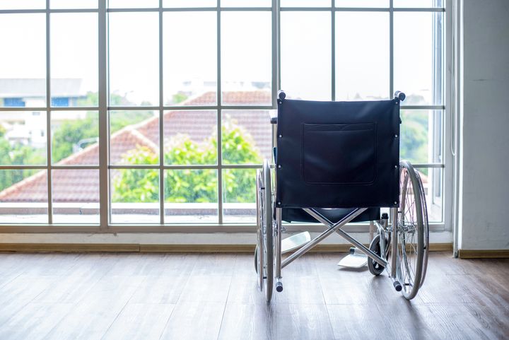 Empty wheelchair in the hospital.beside the big glass window.