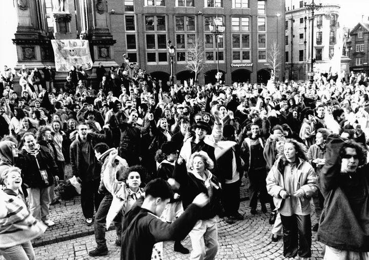Hundreds of protesters hold a huge acid house party in Albert Square, Manchester in protest against police harassment of their gatherings, February 1990