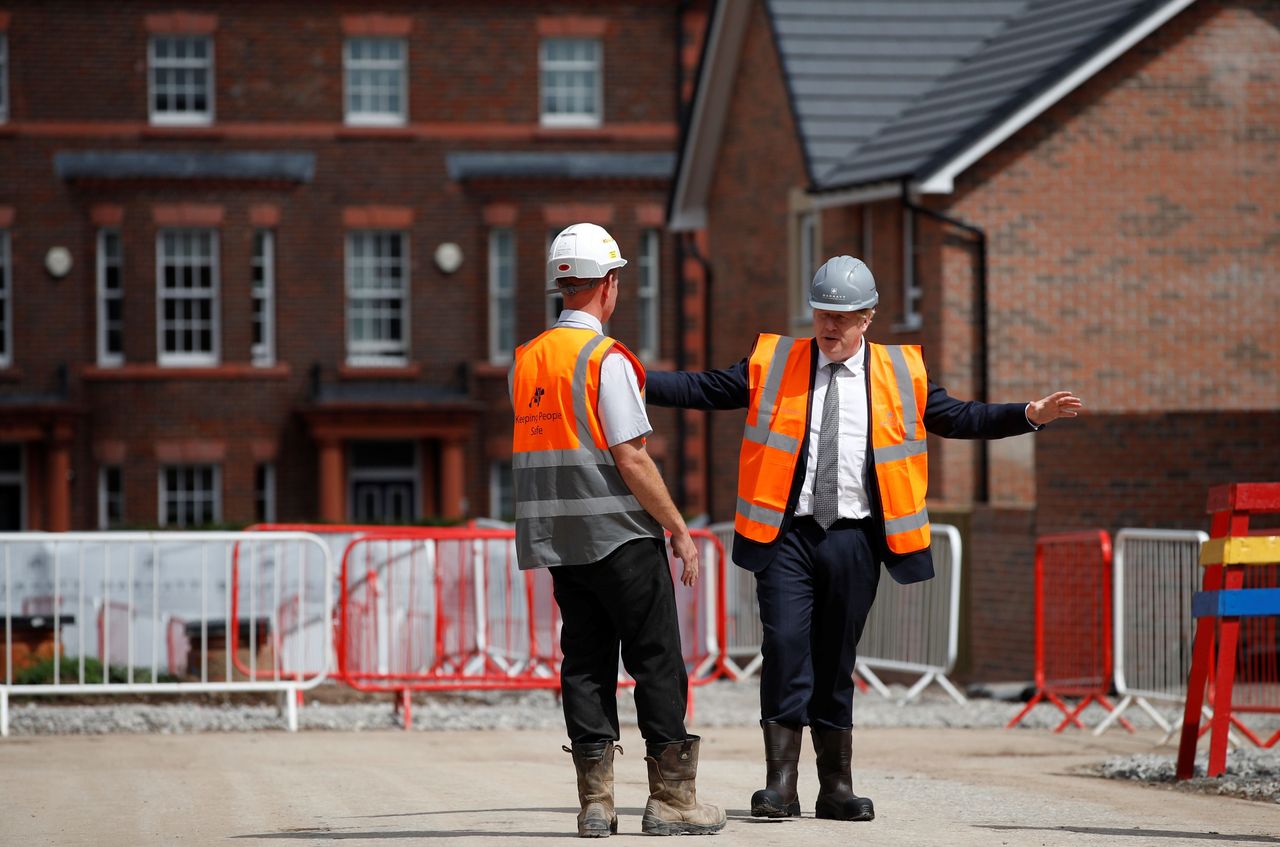 Prime minister Boris Johnson visits a construction site in Warrington in August. The government has been slammed for failing to fund 60,000 housing schemes in the capital
