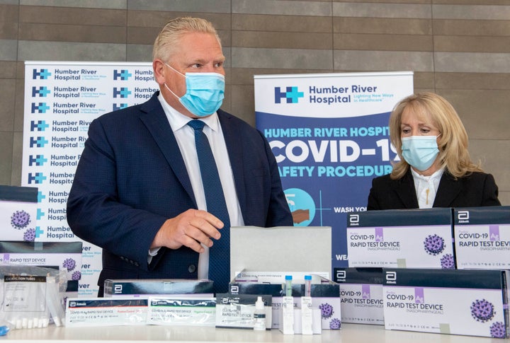 Ontario Premier Doug Ford and Long-Term Care Minister Merrilee Fullerton are briefed on rapid COVID-19 test kits at Humber River Hospital in Toronto on Nov. 24, 2020. 