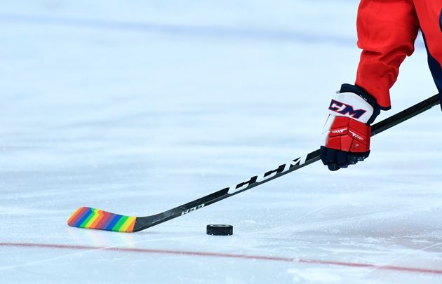 Washington Capitals centre Lars Eller is pictured on the ice with ceremonial rainbow pride tape on his stick.