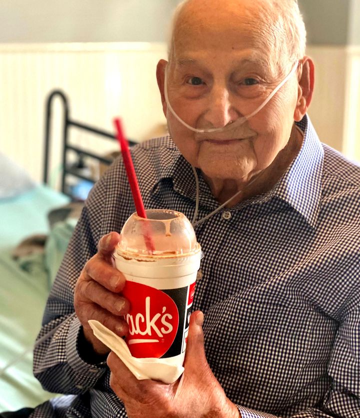 World War II veteran and COVID-19 survivor Major Wooten holds a celebratory milkshake on his 104th birthday on Thursday, Dec. 3, 2020.
