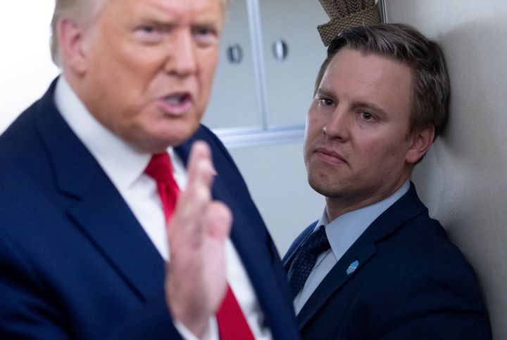 President Donald Trump stands with campaign manager Bill Stepien aboard Air Force One on Aug. 28, 2020.