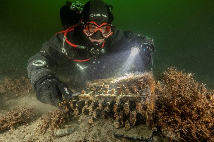 German divers searching the Baltic Sea for discarded fishing nets have stumbled upon a rare Enigma cipher machine used by the Nazi military during World War Two which they believe was thrown overboard from a scuttled submarine.