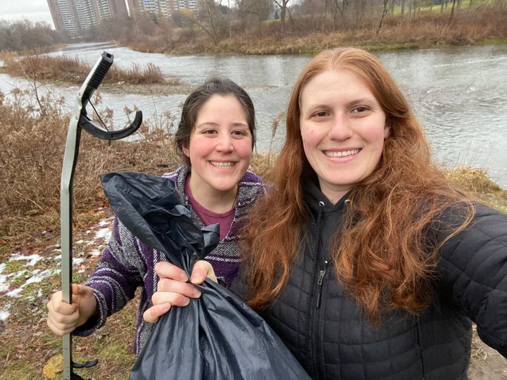 Environmental scientists Justine Ammendolia, left, and Jacquelyn Saturno collect personal protective equipment waste in their Toronto neighbourhood as part of a research study.