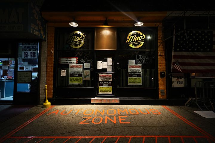 The words "Autonomous Zone" are displayed at the entrance of Mac’s Public House whose owner and manager are refusing to follow coronavirus restrictions implemented by New York Gov. Andrew Cuomo.