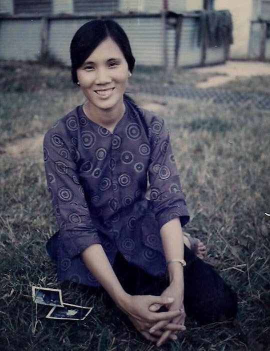 The writer's mother in Vietnam, approximately around 21 years of age.