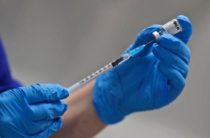 A nurse prepares to administer the Pfizer-BioNTech COVID-19 vaccine at Guy's Hospital in London, Tuesday, Dec. 8, 2020. U.K.