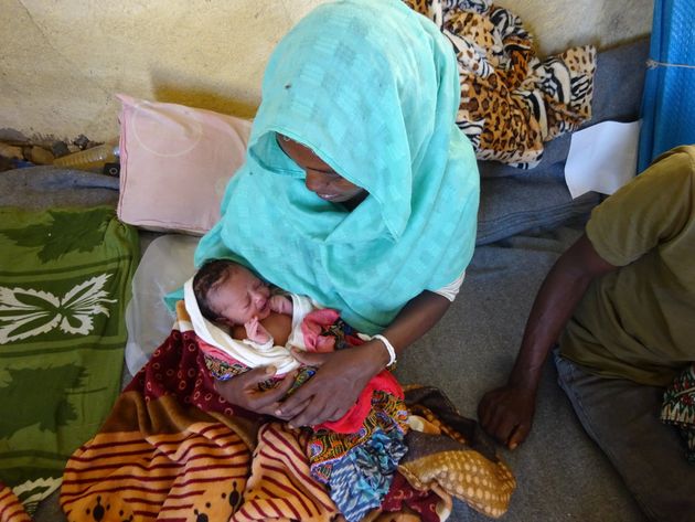 Barakhti, 27, with her baby at Village 8 camp