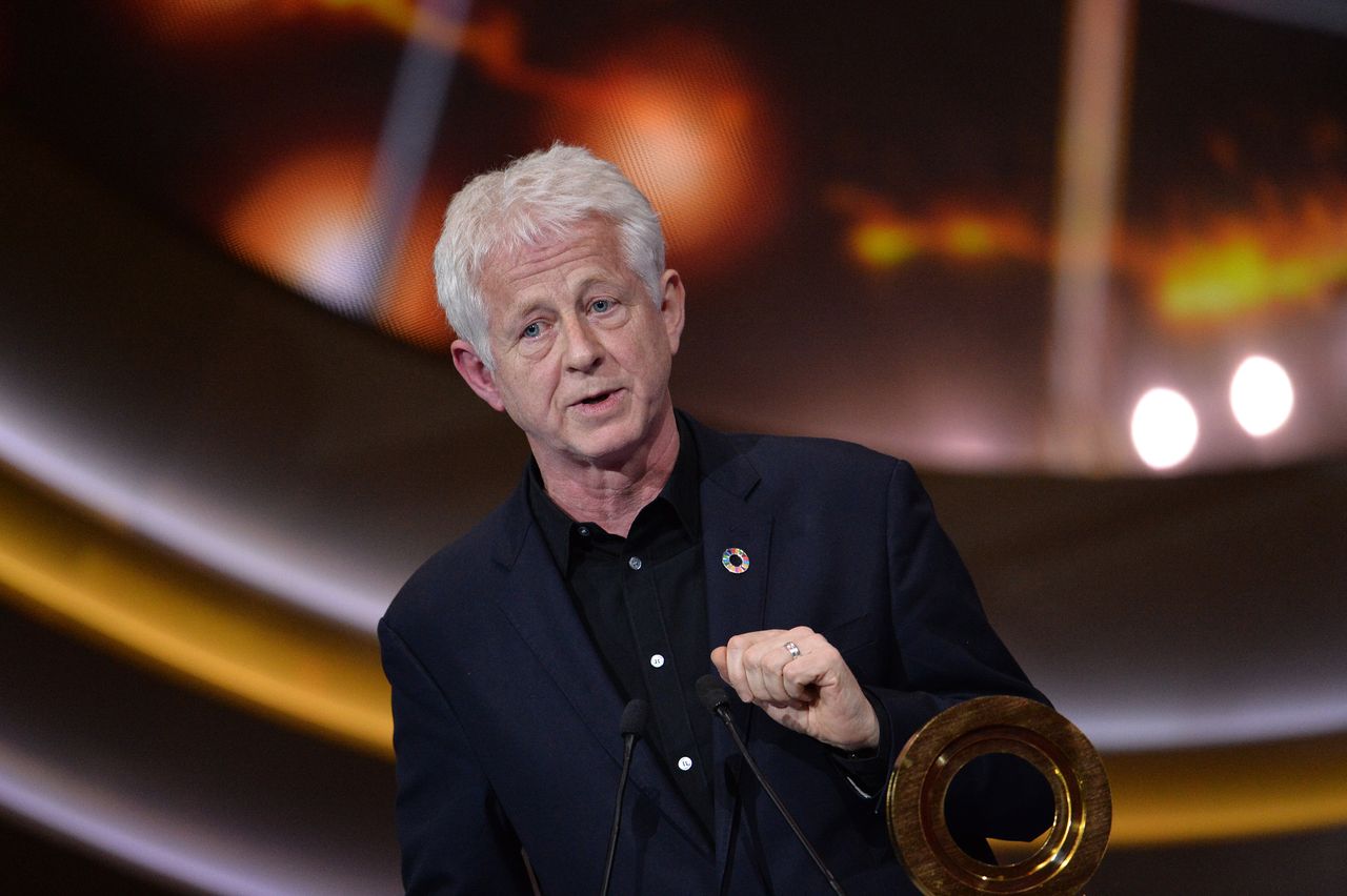 Richard Curtis wrote The Vicar Of Dibley with Paul Mayhew-Archer