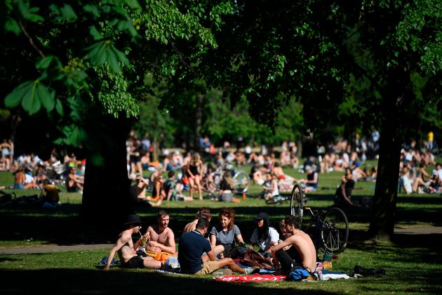 People enjoy the sunshine in parks