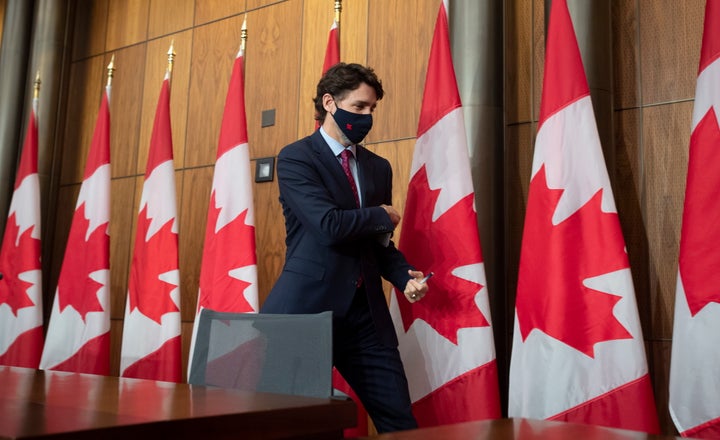 Prime Minister Justin Trudeau leaves a news conference in Ottawa, Monday, Dec. 7, 2020. (Adrian Wyld/The Canadian Press via AP)