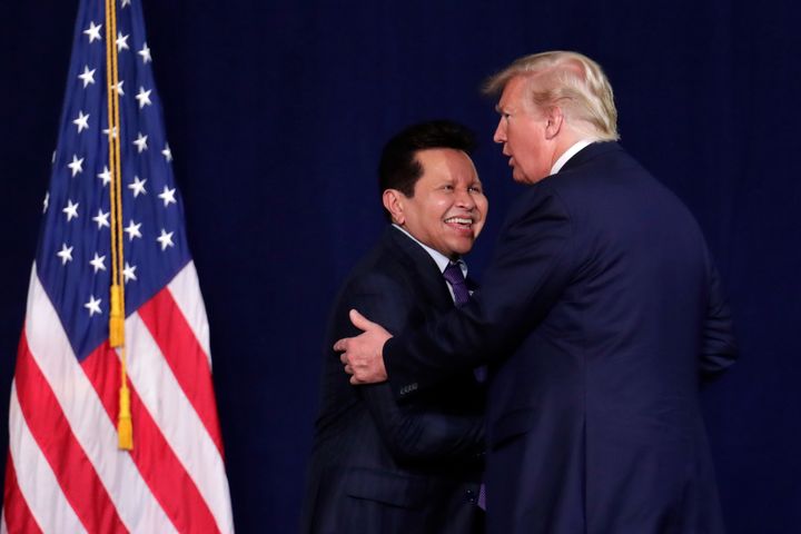 President Donald Trump embraces Guillermo Maldonado during a rally of evangelical supporters at the King Jesus International Ministry church in Miami on Jan. 3, 2020.