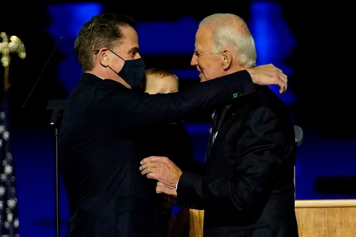 Hunter Biden, seen here with his father President-elect Joe Biden, is under investigation by the Justice Department, the transition team announced Wednesday.