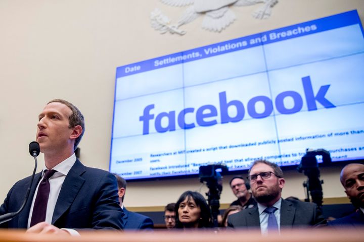 File-This Oct. 23, 2019, file photo shows Facebook CEO Mark Zuckerberg testifying before a House Financial Services Committee hearing on Capitol Hill in Washington. Facebook's stock dropped almost 3% in regular trading after news reports Thursday, Dec. 12, 2019, suggested that the FTC may take antitrust action to prevent Facebook from integrating its disparate messaging apps. The reports said the Federal Trade Commission may seek a court injunction that would block Facebook's “interoperability” plans for Facebook Messenger, WhatsApp and Instagram, which involves revising them to use the same underlying software. (AP Photo/Andrew Harnik, File)