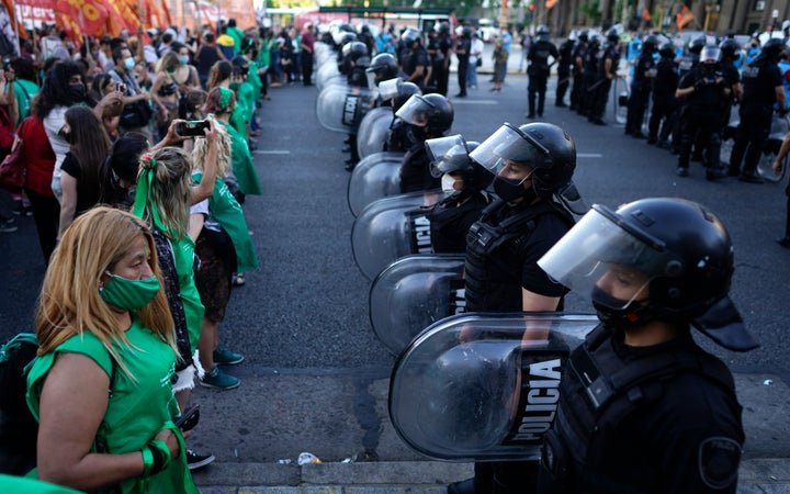 Police stand between pro-choice activists, left, and those against the legalization of abortion in Buenos Aires on Nov. 18.