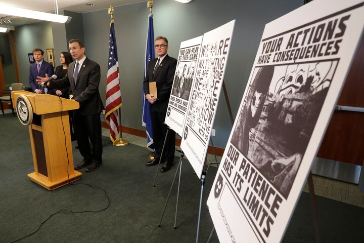 An FBI special agent discusses charges against four alleged members of the neo-Nazi group Atomwaffen Division for cyberstalking and mailing threatening communications to journalists. Some of the threatening posters that were sent to the journalists are displayed.