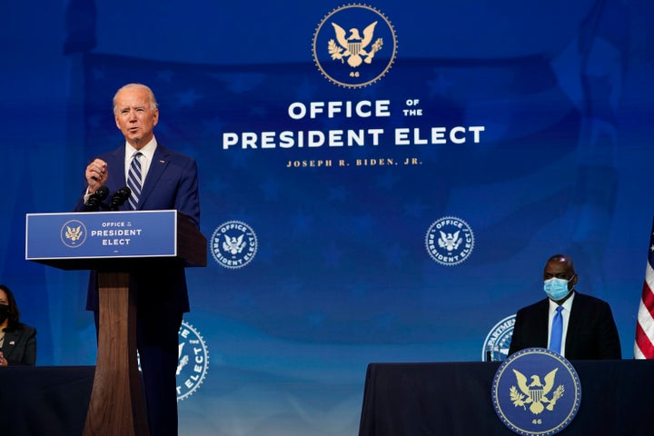 President-elect Joe Biden speaks during an event to announce his choice of retired Army Gen. Lloyd Austin, right, to be secretary of defense, at The Queen theater in Wilmington, Delaware, on Dec. 9.