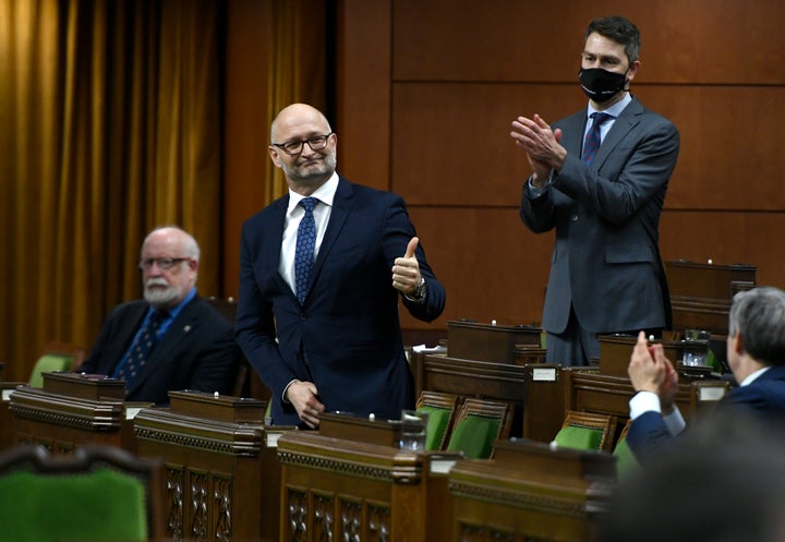 Minister of Justice David Lametti gives a thumbs up as he rises to vote in favour of a motion on Bill C-7 in the House of Commons on Parliament Hill in Ottawa on Thursday.