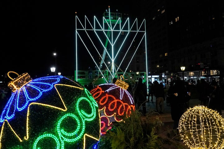 A giant Hanukkah menorah is seen on Thursday, Dec. 10, 2020, along Fifth Avenue in New York, on the first night of the annual eight-day long Jewish festival of lights. Due to coronavirus restrictions, a limited and socially-distanced crowd was allowed to attend.