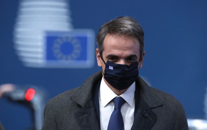 Greek Prime Minister Kyriakos Mitsotakis arrives for an EU summit at the European Council building in Brussels, Thursday, Dec. 10, 2020. European Union leaders meet for a year-end summit that will address anything from climate, sanctions against Turkey to budget and virus recovery plans. Brexit will be discussed on the sidelines. (Yves Herman, Pool via AP)