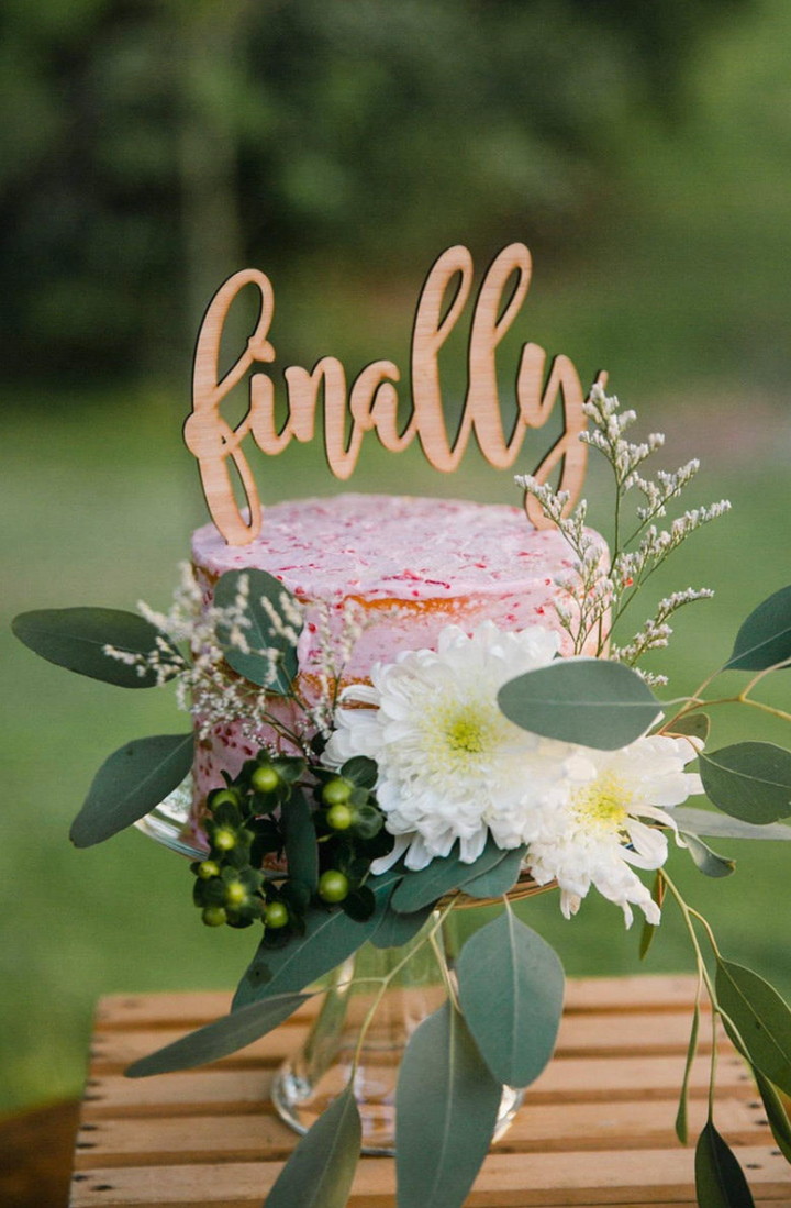 Cake topper from <a href="https://www.etsy.com/uk/listing/659656780/finally-wedding-cake-topper-wedding-cake?ga_order=most_relevant&ga_search_type=all&ga_view_type=gallery&ga_search_query=finally+cake+topper&ref=sc_gallery-1-6&plkey=1455d5d48d9049b5b4459ba6dc88bb284c1672f2%3A659656780&col=1" target="_blank" role="link" class=" js-entry-link cet-external-link" data-vars-item-name="RubiandLib/Etsy" data-vars-item-type="text" data-vars-unit-name="5fd393f3c5b68ce17187b6a2" data-vars-unit-type="buzz_body" data-vars-target-content-id="https://www.etsy.com/uk/listing/659656780/finally-wedding-cake-topper-wedding-cake?ga_order=most_relevant&ga_search_type=all&ga_view_type=gallery&ga_search_query=finally+cake+topper&ref=sc_gallery-1-6&plkey=1455d5d48d9049b5b4459ba6dc88bb284c1672f2%3A659656780&col=1" data-vars-target-content-type="url" data-vars-type="web_external_link" data-vars-subunit-name="article_body" data-vars-subunit-type="component" data-vars-position-in-subunit="5">RubiandLib/Etsy</a>.