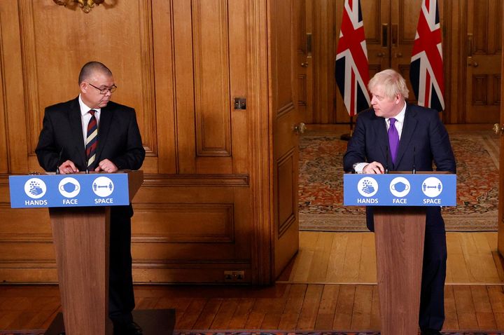 England's deputy chief medical officer Jonathan van Tam and prime minister Boris Johnson at a Downing Street news conference.