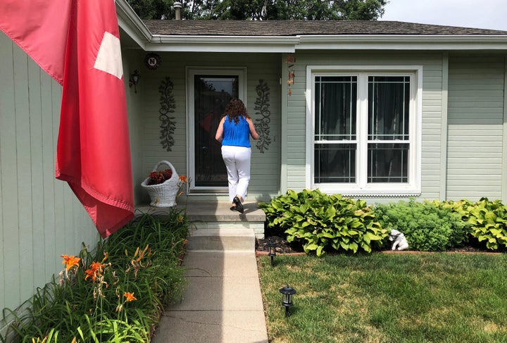 Eastman knocks on a voter’s door in Omaha in July 2018. Eastman and the state Democratic Party stopped canvassing this cycle after March due to the COVID-19 pandemic.