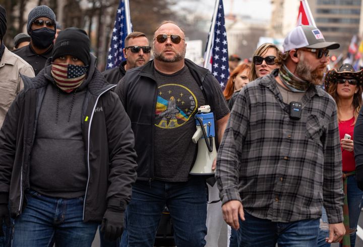 Far-right conspiracy theorist Alex Jones joins supporters of President Donald Trump at a rally in Washington Saturday.