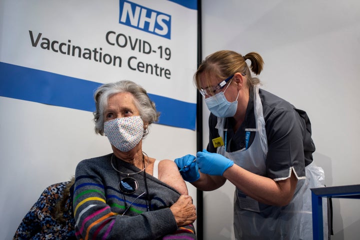 Dr Doreen Brown, 85, receives the first of two Pfizer/BioNTech COVID-19 vaccine jabs administered at Guy's Hospital in London last Tuesday.