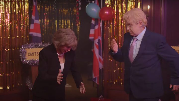 Johnson and May have a dance-off in the Can't Stop Christmas video
