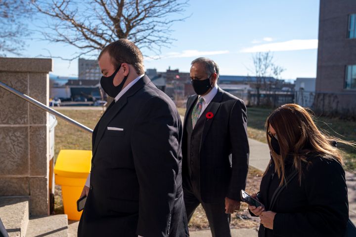 Brayden Bushby, left, along with his lawyer George Joseph, centre, enter the courthouse ahead of the second day of his manslaughter trial in Thunder Bay, Ont., Tuesday, Nov. 3, 2020. Bushby, 21, threw a trailer hitch at Barbara Kentner, a First Nations woman who died several months after the 2017 assault.