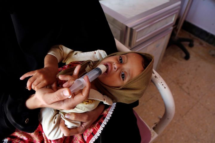 A malnourished child is fed in Al-Sabeen hospital in Sanaa, Yemen, on Dec. 13. Millions in the country are on the brink of fa