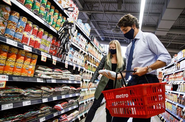 Prime Minister Justin Trudeau shops at a Metro earlier this year before dropping the items in a bin destined for a food bank.