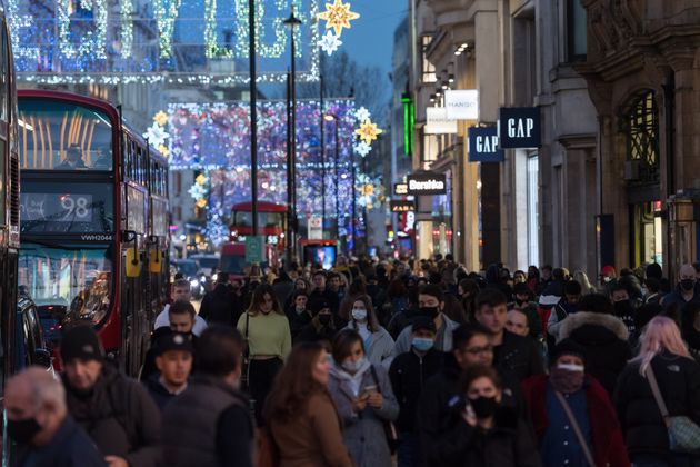 Crowds of shoppers and commuters walk along Oxford Street ahead of introduction of tougher coronavirus restrictions in the run up to Christmas, on December 15