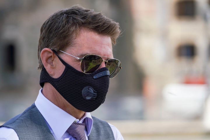 Tom Cruise during a break in filming for "Mission Impossible 7" along Rome's Fori Imperiali avenue. Filming in Italy was shut down in October for a week after a dozen people on set tested positive for COVID-19.