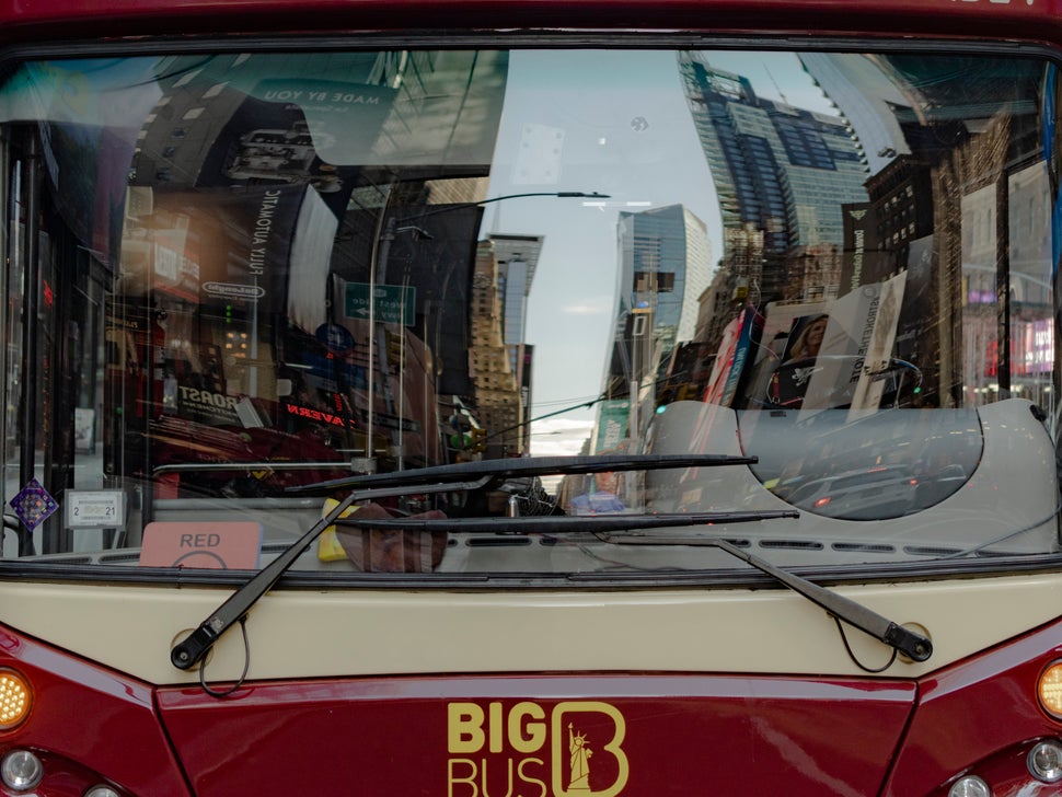 A double-decker tour bus belonging to the Big Bus tour company prepares to depart on a downtown route. The route got cut down and now only makes five stops; it would make more than 20 on a pre-pandemic tour.