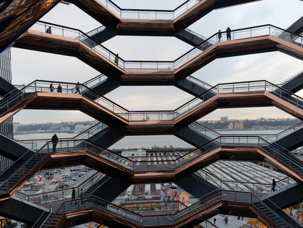 People walking through the Vessel structure at the Hudson Yards in Manhattan.