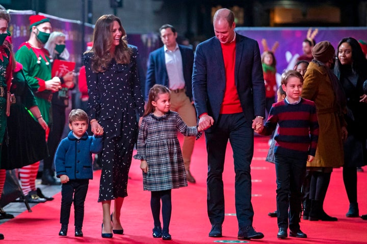 The Duke and Duchess of Cambridge, along with their three children, arrive for a special pantomime performance at London's Pa