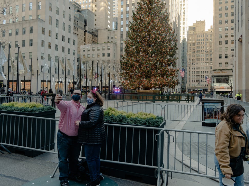 A couple takes a selfie with the Christmas tree at Rockefeller Center. 