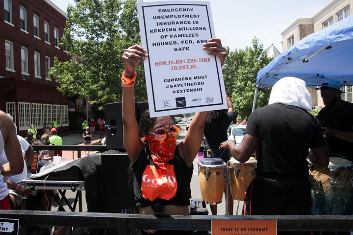 Protesters block the street to Senate Majority Leader Mitch McConnell's Washington, D.C., house on July 22, demanding the extension of coronavirus-related unemployment aid.