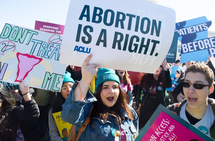 Pro-choice activists supporting legal access to abortion protest during a demonstration outside the US Supreme Court in Washington, DC, March 4, 2020, as the Court hears oral arguments regarding a Louisiana law about abortion access in the first major abortion case in years. - The United States Supreme Court on Wednesday will hear what may be its most significant case in decades on the controversial subject of abortion. At issue is a state law in Louisiana which requires doctors who perform abortions to have admitting privileges at a nearby hospital. (Photo by SAUL LOEB / AFP) (Photo by SAUL LOEB/AFP via Getty Images)