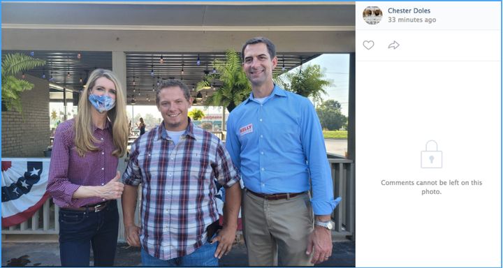 Sens. Kelly Loeffler and Tom Cotton pose for a photo with Joshua Mote (center), Lumpkin County coordinator for American Patriots USA, a Georgia extremist group founded by Chester Doles.