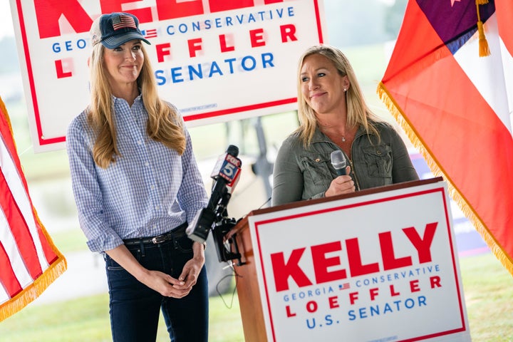 Loeffler and then-House candidate Marjorie Taylor Greene speak at a news conference in Dallas, Georgia, on Oct. 15, 2020.