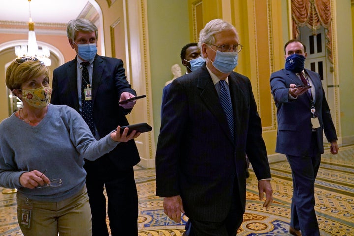 Senate Majority Leader Mitch McConnell of Ky., walks past reporters on Capitol Hill in Washington, Tuesday, Dec. 15, 2020. (A