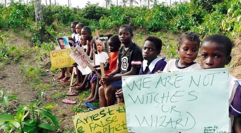 Children in Nigeria pose with signs opposing the labelling of them as "witches and wizards". There has been a disturbing rise in abuse of children associated with witchcraft and experts fear coronavirus will make things much worse for the vulnerable