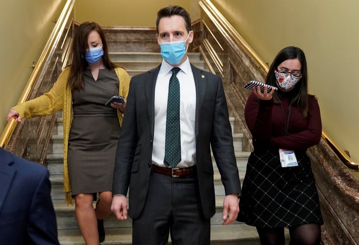 Sen. Josh Hawley (R-Mo.) threatened to block a short-term government spending bill on Friday if he doesn't see progress on la
