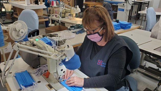 A CORCAN worker sews a face mask in a April 30, 2020 photo shared by the Correctional Service of