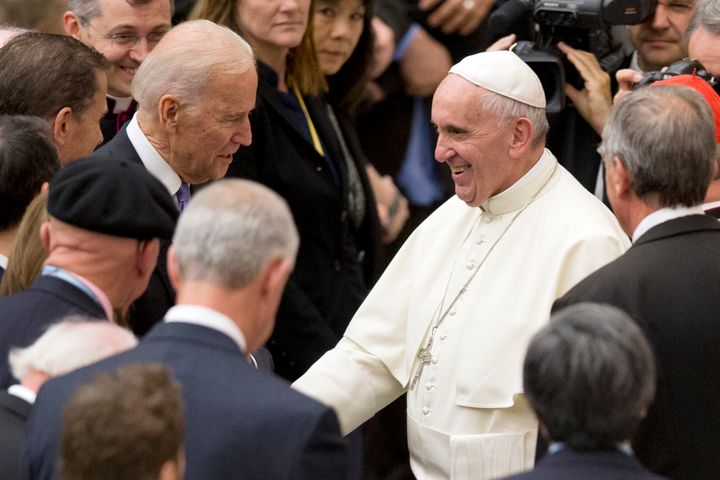 Then-Vice President Joe Biden shakes hands with Pope Francis during a conference in April 2016 on cancer research at the Vatican.