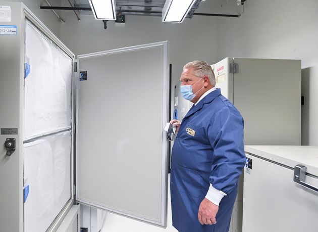 Ontario Premier Doug Ford looks at freezers ahead of COVID-19 vaccine distribution in Toronto on Dec....